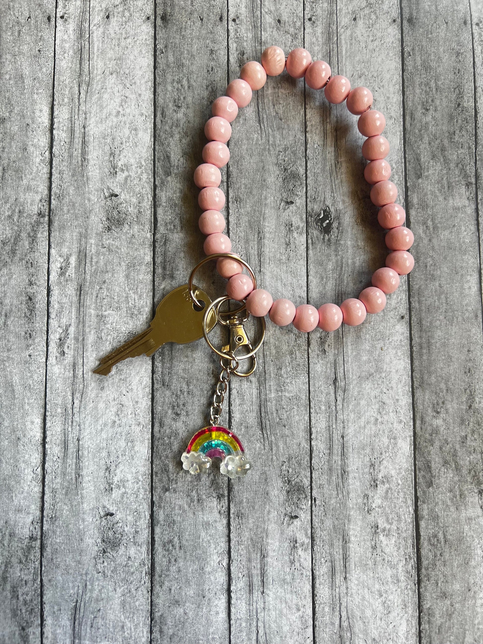 This keychain would be the perfect length to add to any backpack, wristlet or etc. The Keychain is approximately 2.5 inches in length.